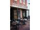 Charming exterior of local store featuring outdoor seating and brick facade at 362 Olmstead Way # 23, Alpharetta, GA 30022