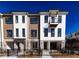 Modern townhome exterior with brick and siding details plus a small balcony at 362 Olmstead Way # 23, Alpharetta, GA 30022