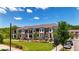 Exterior of townhomes featuring manicured lawns, modern architecture and inviting street appeal in a desirable neighborhood at 362 Olmstead Way # 23, Alpharetta, GA 30022