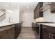 Contemporary kitchen with stainless appliances, island, and sleek dark cabinetry at 362 Olmstead Way # 23, Alpharetta, GA 30022