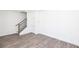 Bright, open living area with modern flooring and staircase at 362 Olmstead Way # 23, Alpharetta, GA 30022