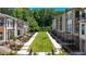 Beautiful townhomes with modern finishes and manicured lawns, offering a sense of community and style at 362 Olmstead Way # 23, Alpharetta, GA 30022