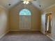 Spacious bedroom features a vaulted ceiling, plush carpet, and a large window with plantation shutters at 512 Ollas Walk, Mcdonough, GA 30252