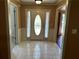 The foyer features decorative front door, tile flooring and neutral colors at 512 Ollas Walk, Mcdonough, GA 30252