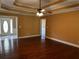Open floorplan living room with hardwood flooring that opens to the entryway at 512 Ollas Walk, Mcdonough, GA 30252