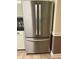 Stainless steel, french door refrigerator complements kitchen cabinetry and design at 512 Ollas Walk, Mcdonough, GA 30252