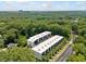 Aerial view of modern townhomes surrounded by mature trees and city views at 1103 Briar Cove Ne Cir, Atlanta, GA 30329