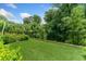 Lush backyard with a swing set, privacy fence, and well-maintained lawn at 1103 Briar Cove Ne Cir, Atlanta, GA 30329