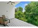 Inviting balcony with comfortable seating and a view of lush trees at 1103 Briar Cove Ne Cir, Atlanta, GA 30329
