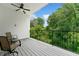 Inviting balcony with comfortable seating and a view of lush trees at 1103 Briar Cove Ne Cir, Atlanta, GA 30329