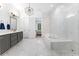 Spacious bathroom featuring double vanities, a shower, and soaking tub at 1103 Briar Cove Ne Cir, Atlanta, GA 30329