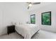 Airy bedroom featuring comfortable bed, modern design, black trim windows and ample natural light at 1103 Briar Cove Ne Cir, Atlanta, GA 30329