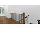 Upstairs hallway with hardwood floors and decorative railings at 1103 Briar Cove Ne Cir, Atlanta, GA 30329