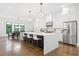 Bright, open kitchen with a large island, stainless steel appliances, and a connected dining area at 1103 Briar Cove Ne Cir, Atlanta, GA 30329