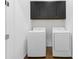 Convenient laundry room with washer, dryer, and overhead cabinet storage at 1103 Briar Cove Ne Cir, Atlanta, GA 30329