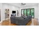 Modern living room with fireplace, television, and large glass doors to outdoor living space at 1103 Briar Cove Ne Cir, Atlanta, GA 30329