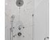Elegant shower featuring marble-patterned tile, rain shower head, and glass enclosure at 1103 Briar Cove Ne Cir, Atlanta, GA 30329