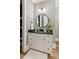 Elegant bathroom featuring a modern vanity with a sleek countertop and stylish fixtures at 150 Trinity Farm Dr, Canton, GA 30115