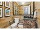 Stylish powder room with wood paneling, modern fixtures, and decorative artwork at 150 Trinity Farm Dr, Canton, GA 30115