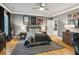 Spacious primary bedroom featuring hard wood floors, an ceiling fan, and gray paint at 150 Trinity Farm Dr, Canton, GA 30115