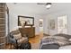Comfortable bedroom showcasing a wooden dresser and a plush armchair at 150 Trinity Farm Dr, Canton, GA 30115