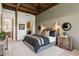 Spacious bedroom featuring exposed ceiling beams, ensuite bathroom/laundry, and ample natural light at 150 Trinity Farm Dr, Canton, GA 30115