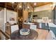 Elevated dining area with a unique chandelier, high ceilings, and an open layout at 150 Trinity Farm Dr, Canton, GA 30115