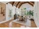 Bright dining room features vaulted wood ceilings and views of the landscaped yard at 150 Trinity Farm Dr, Canton, GA 30115