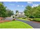 Inviting property with a charming farmhouse, circular driveway, and manicured lawn and landscaping at 150 Trinity Farm Dr, Canton, GA 30115