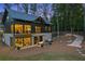 Charming home with a stone foundation, a cozy patio, and a private backyard surrounded by mature trees at 150 Trinity Farm Dr, Canton, GA 30115
