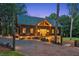 Beautiful home with stone accents, an outdoor area, and a nicely landscaped yard at 150 Trinity Farm Dr, Canton, GA 30115