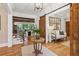 Elegant foyer with wood floors, staircase, and barn door detail at 150 Trinity Farm Dr, Canton, GA 30115