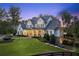 Elegant two-story home displays a well-kept lawn, welcoming porch, and traditional design elements at 150 Trinity Farm Dr, Canton, GA 30115