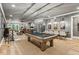 Large game room with a pool table, bar area, and comfortable seating at 150 Trinity Farm Dr, Canton, GA 30115