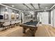 Spacious game room with a pool table, bar seating, and stylish lighting at 150 Trinity Farm Dr, Canton, GA 30115
