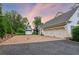 Large three-car garage with ample parking space, extra garage space, and a well-maintained driveway at 150 Trinity Farm Dr, Canton, GA 30115