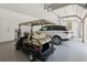 Spacious garage with epoxy flooring, car and golf cart parking, and ample storage at 150 Trinity Farm Dr, Canton, GA 30115