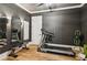 Home gym featuring modern exercise equipment, mirrors, and neutral color palette at 150 Trinity Farm Dr, Canton, GA 30115