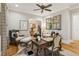 Inviting home office with a rustic desk, hardwood floors, and a large decorative mirror at 150 Trinity Farm Dr, Canton, GA 30115
