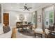 Comfortable home office featuring a decorative clock, hardwood floors, and a ceiling fan at 150 Trinity Farm Dr, Canton, GA 30115