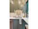 Close up on well-lit kitchen featuring stone countertops, stainless steel appliances, and green cabinetry at 150 Trinity Farm Dr, Canton, GA 30115