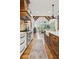 Bright kitchen featuring a large center island, modern countertops, and a vaulted ceiling in the dining area at 150 Trinity Farm Dr, Canton, GA 30115
