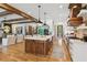 Open kitchen with a large central island and countertops, seamlessly connected to the living area at 150 Trinity Farm Dr, Canton, GA 30115