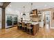 An open kitchen with stainless steel appliances, brick accent wall, and a large center island at 150 Trinity Farm Dr, Canton, GA 30115