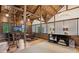 Large living area with wooden walls, high ceilings, ladder, and modern decor at 150 Trinity Farm Dr, Canton, GA 30115