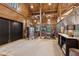 Spacious living area featuring high ceilings, a ladder, and stylish decor at 150 Trinity Farm Dr, Canton, GA 30115