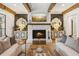Cozy living room with a fireplace, stylish decor, and bright lighting at 150 Trinity Farm Dr, Canton, GA 30115