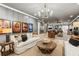 Open-concept living room showcasing couches, decor, and seamless transition to entertainment areas at 150 Trinity Farm Dr, Canton, GA 30115