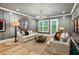 Comfortable living room with couches, a chandelier, and natural light from shuttered windows at 150 Trinity Farm Dr, Canton, GA 30115