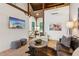 Cozy living room with high ceilings, unique art, and comfortable seating arrangements at 150 Trinity Farm Dr, Canton, GA 30115